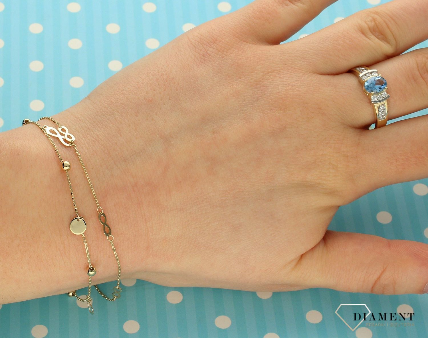 Złoty pierścionek 333 niebieskie oczko i błyszcząca cyrkonia PI 734C 333.jpg